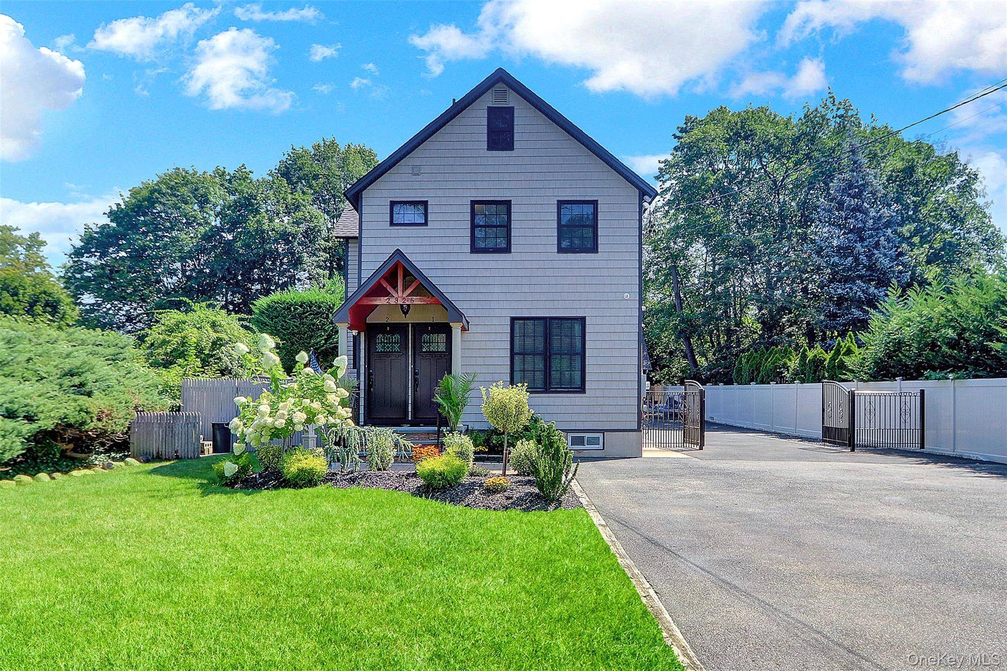 Welcome to this beautifully updated Bellmore Duplex, offering versatile living with two separate entrances and endless possibilities.