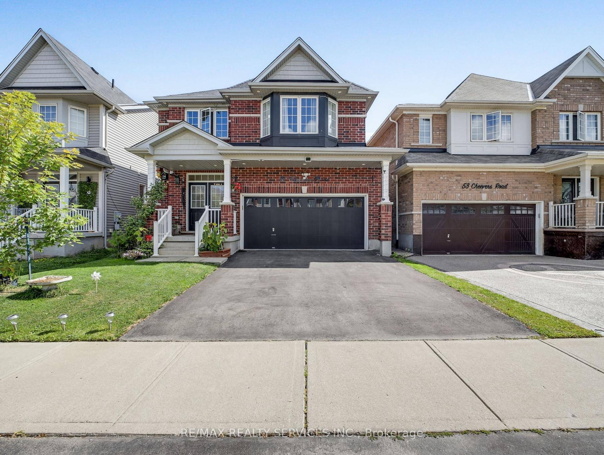 Welcome to 51 Cheevers Road a meticulously updated family home offering four spacious bedrooms, three full bathrooms, a convenient powder room, and an attached double car garage.