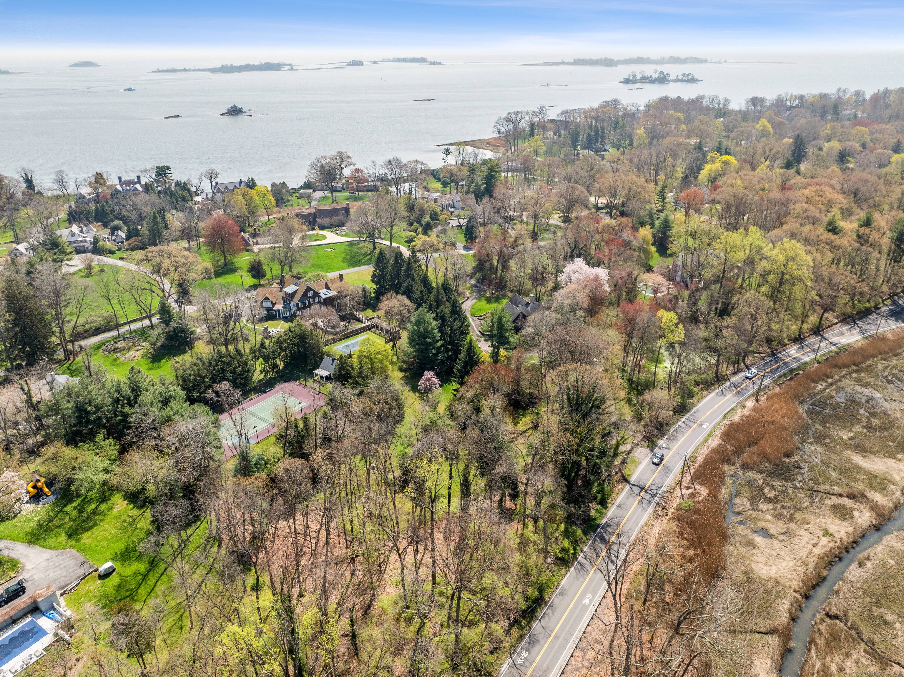 Unbelievable opportunity to build your ideal home on this stunning rare 1 acre parcel in coveted Wilson Point Association.