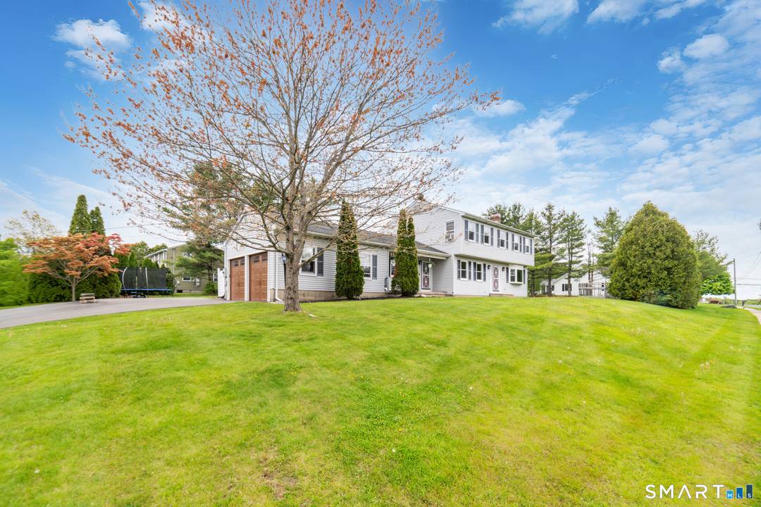 Beautifully maintained 4 bedroom Colonial set on a picturesque.