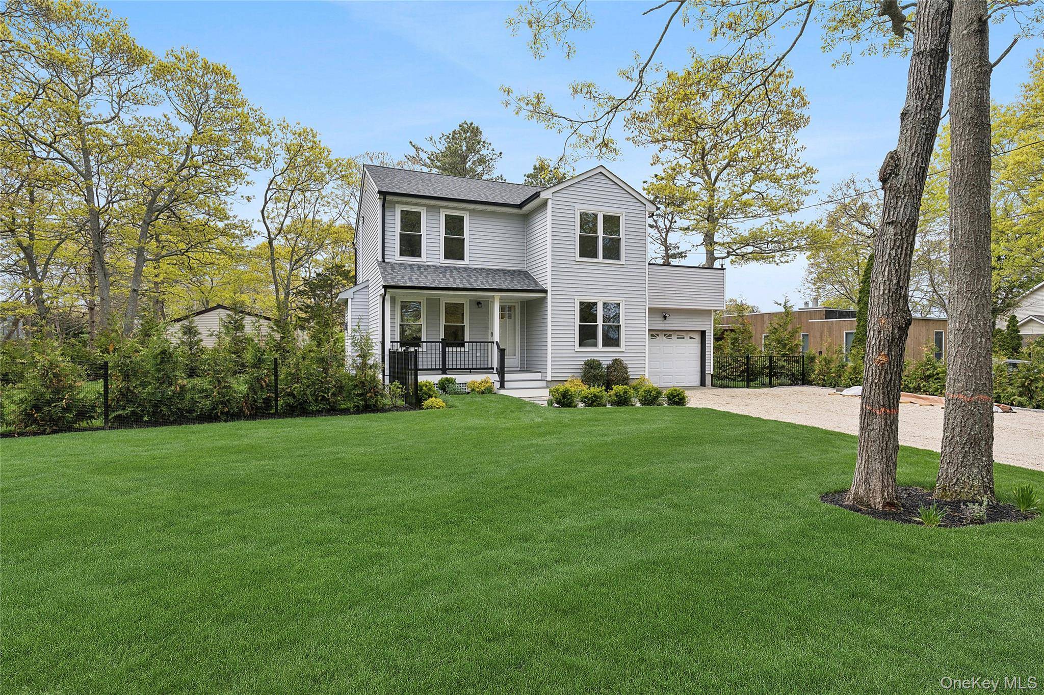 Step inside to an inviting completely renovated open concept kitchen featuring sleek quartz countertops and high end stainless steel appliances, perfect for everyday living and entertaining.
