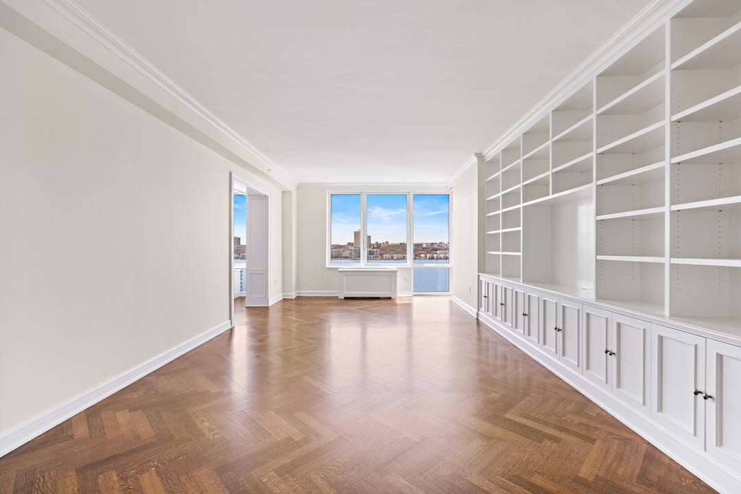 Pristine, fully renovated apartment with sweeping Hudson River and city views.