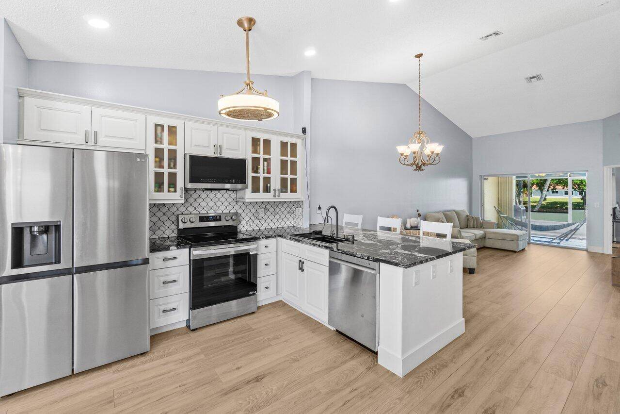 Welcome to a beautifully remodeled gem nestled in the highly sought after Waterways at Delray.