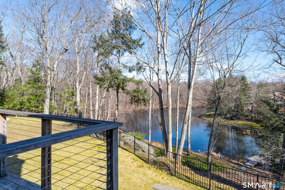 Lakefront living ! This elegant home features 450 ft of private, pristine lakefront in a coveted area of North Stamford CT !
