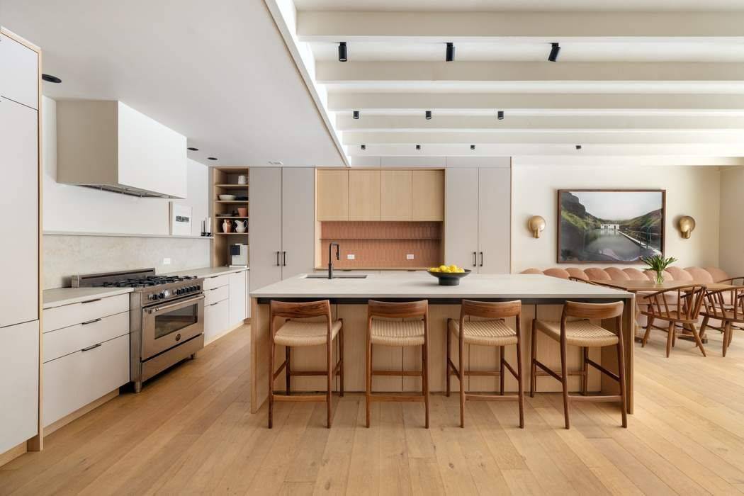 Experience the privacy and scale of townhouse living with the ease and amenities of a full service condominium in this exceptional Carroll Gardens duplex with a spectacular landscaped private garden ...