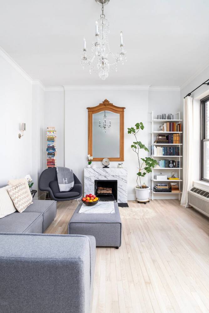 Light filled and impeccably renovated top floor UES Residence with high ceilings and wood burning fireplace.