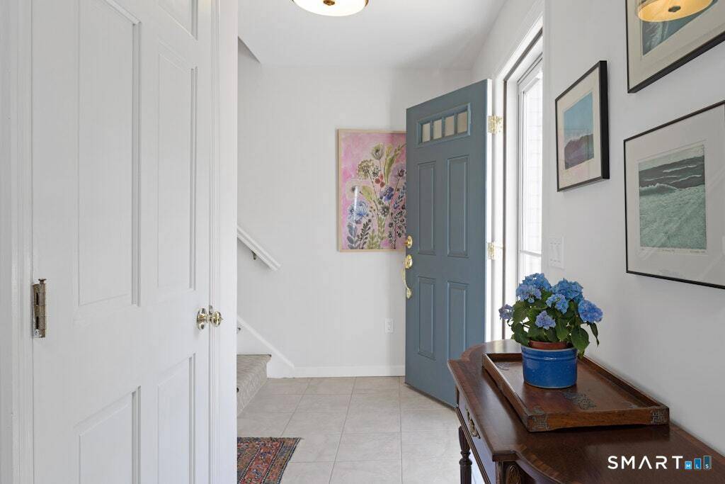 This light filled corner townhome in Prospect Woods has been beautifully updated including recent total window replacement for easy, maintenance free living.