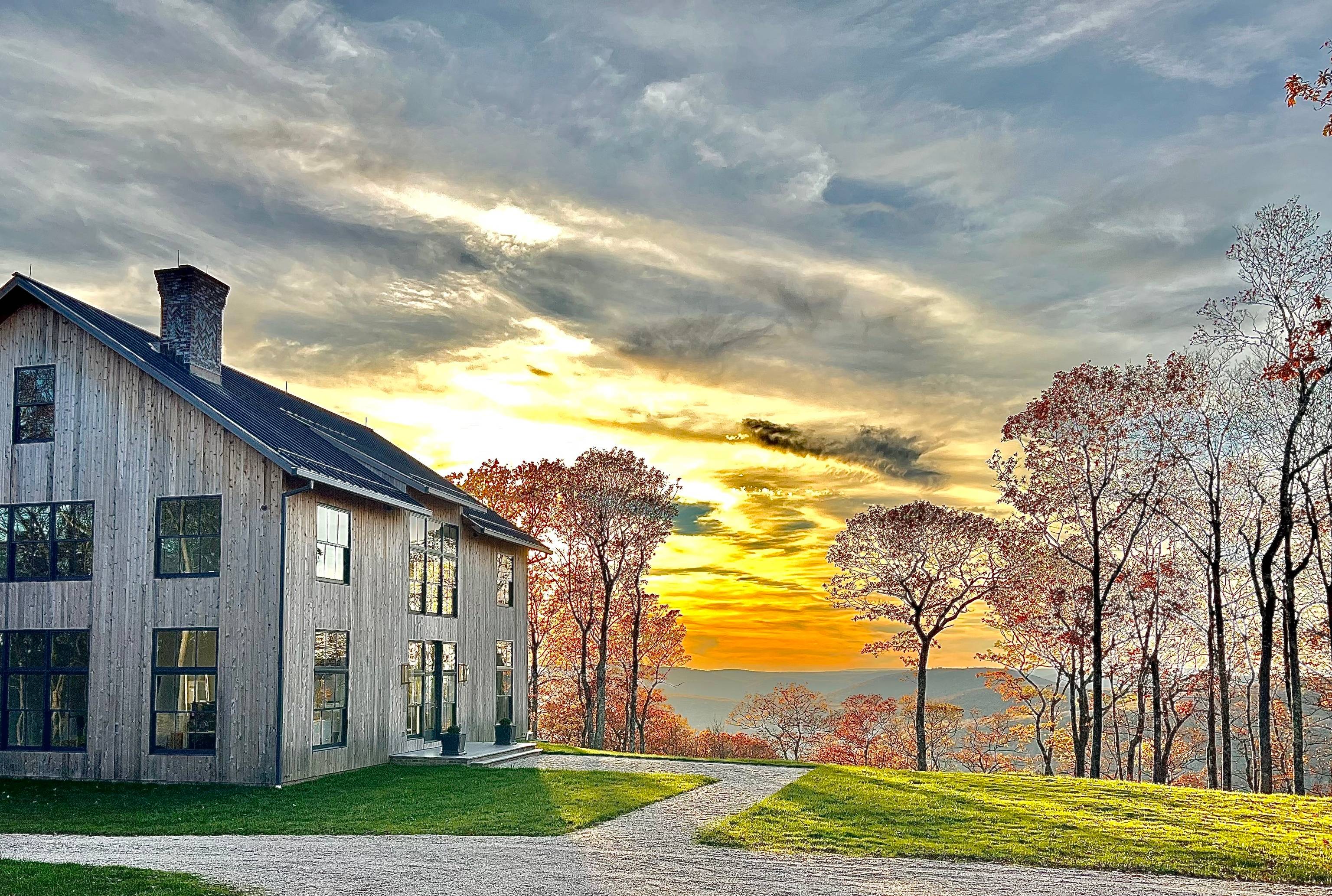 Modern in the Litchfield Hills This modern masterpiece enjoys spectacular sunset views that stretch to the Catskill Mountains in the distance.