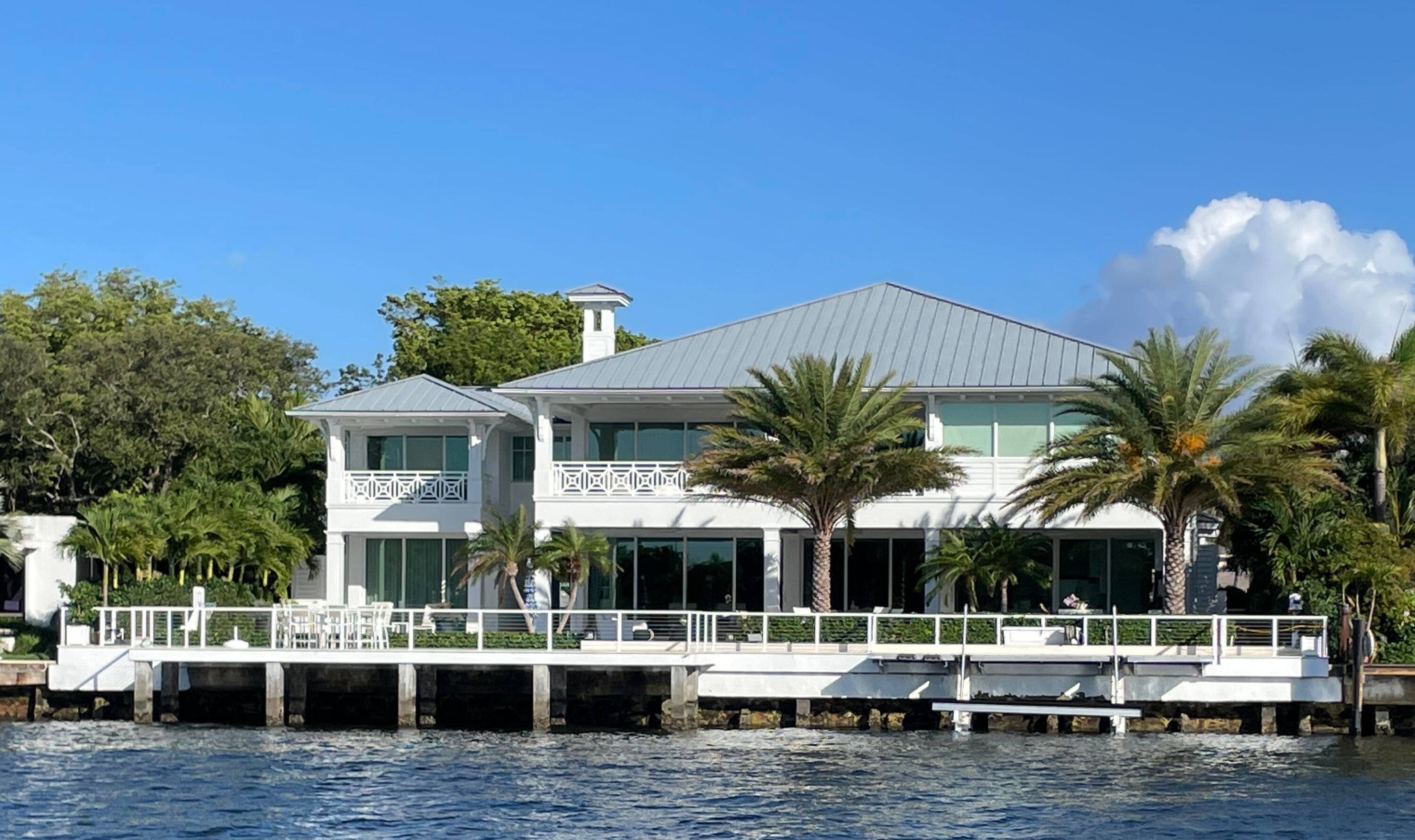Extraordinary custom built coastal modern inspired Intracoastal estate offers a rare amp ; relaxed island ambiance !