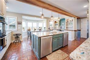 Fabulous Horse property with charming 4 bedroom Farmhouse and 6 stall barn all on 10 meticulously maintained pasture like fenced acres with a pond.