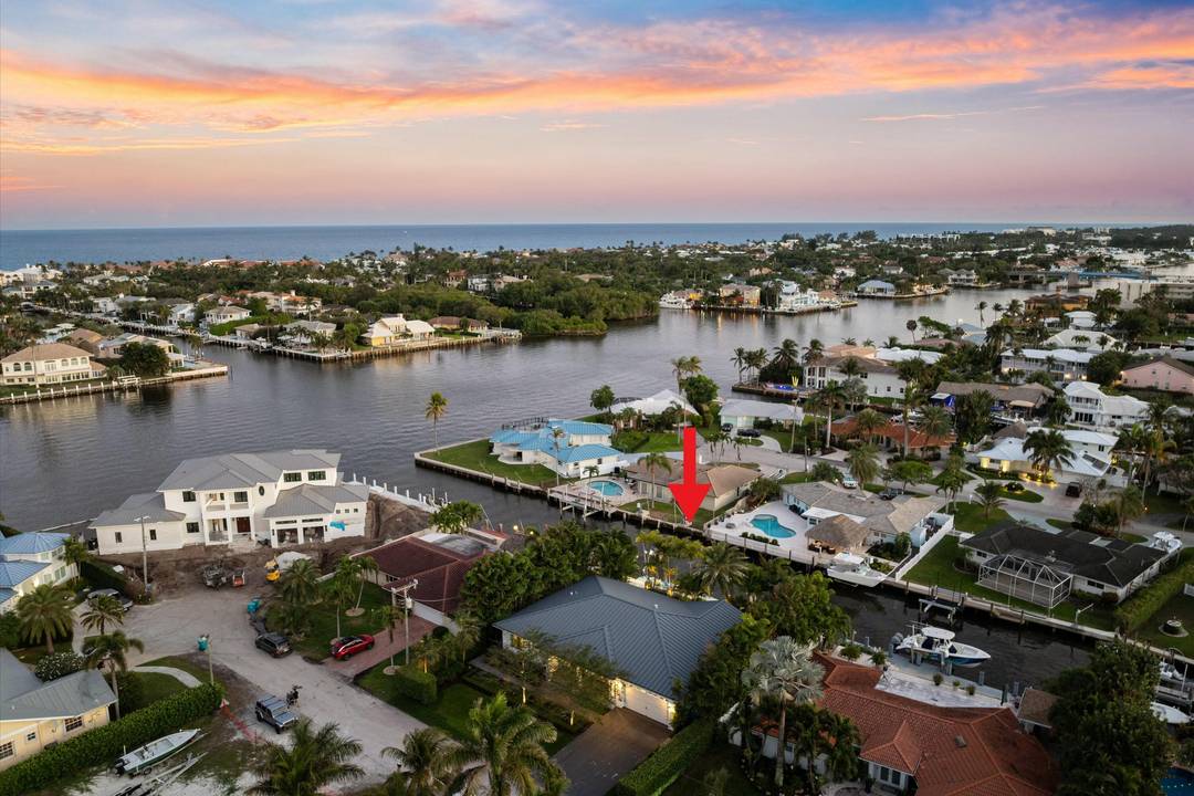 This exceptional waterfront residence has been completely rebuilt from the ground up, with only one original garage wall retained to meet city remodel regulations.
