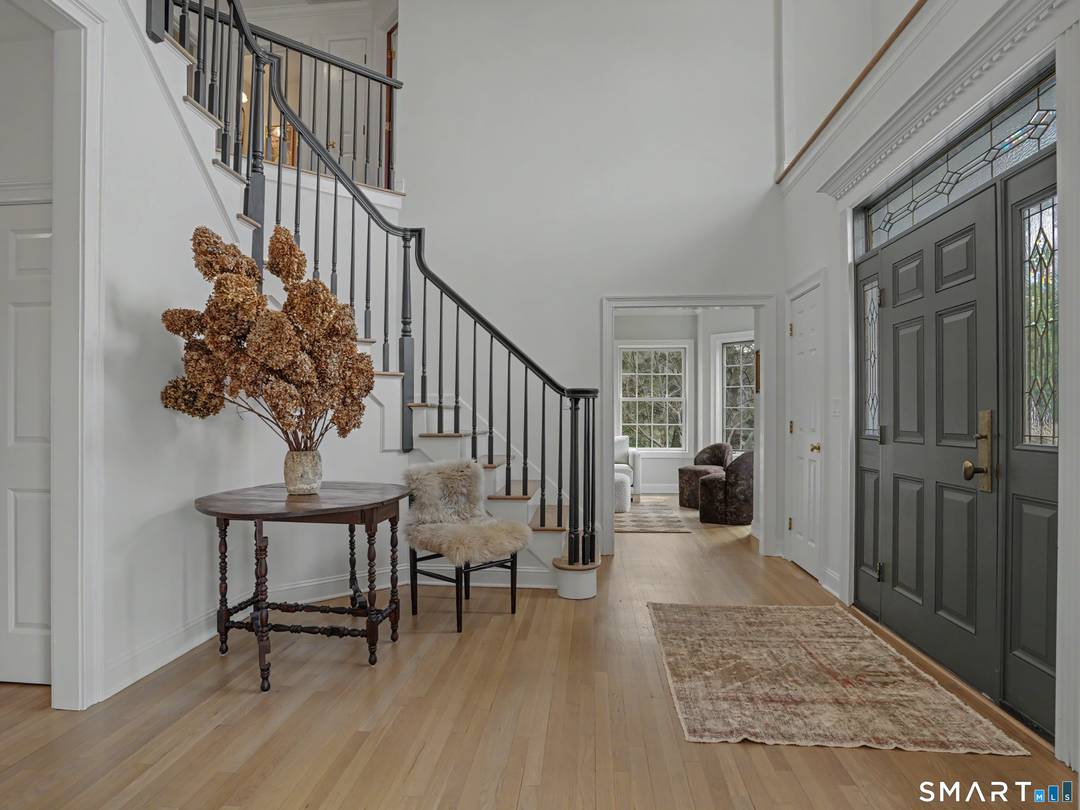 Situated on a private level acre in the prestigious Upper Newfield area of Stamford, this exceptional 4 bedroom, 3.