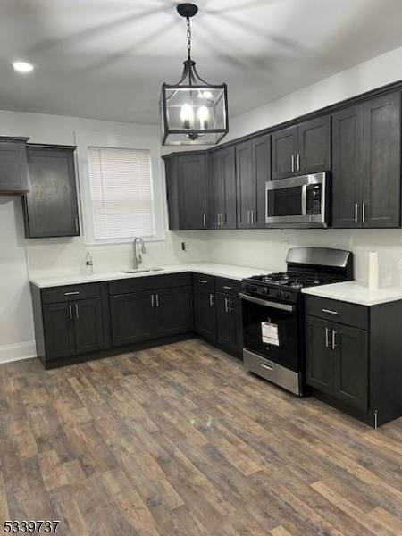 Welcome to this beautifully renovated 4 bedroom, 2 bathroom multi family home in the heart of Newark, NJ.