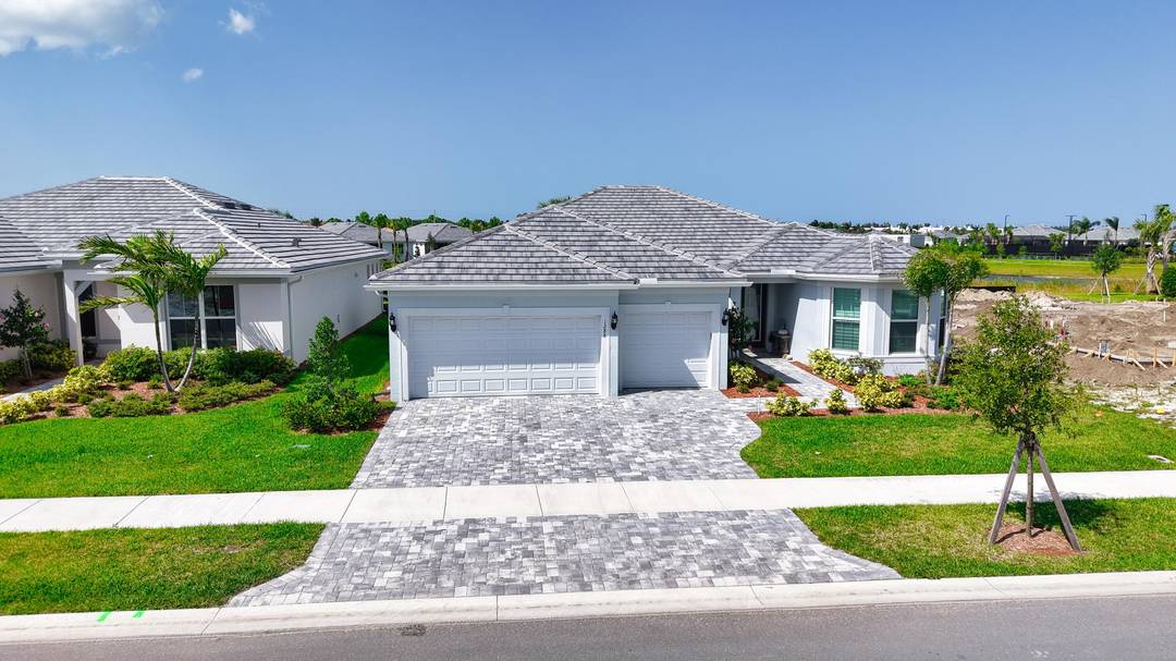 Luxurious 2024 single family home on a premium lakefront estate lot in Costa Pointe.