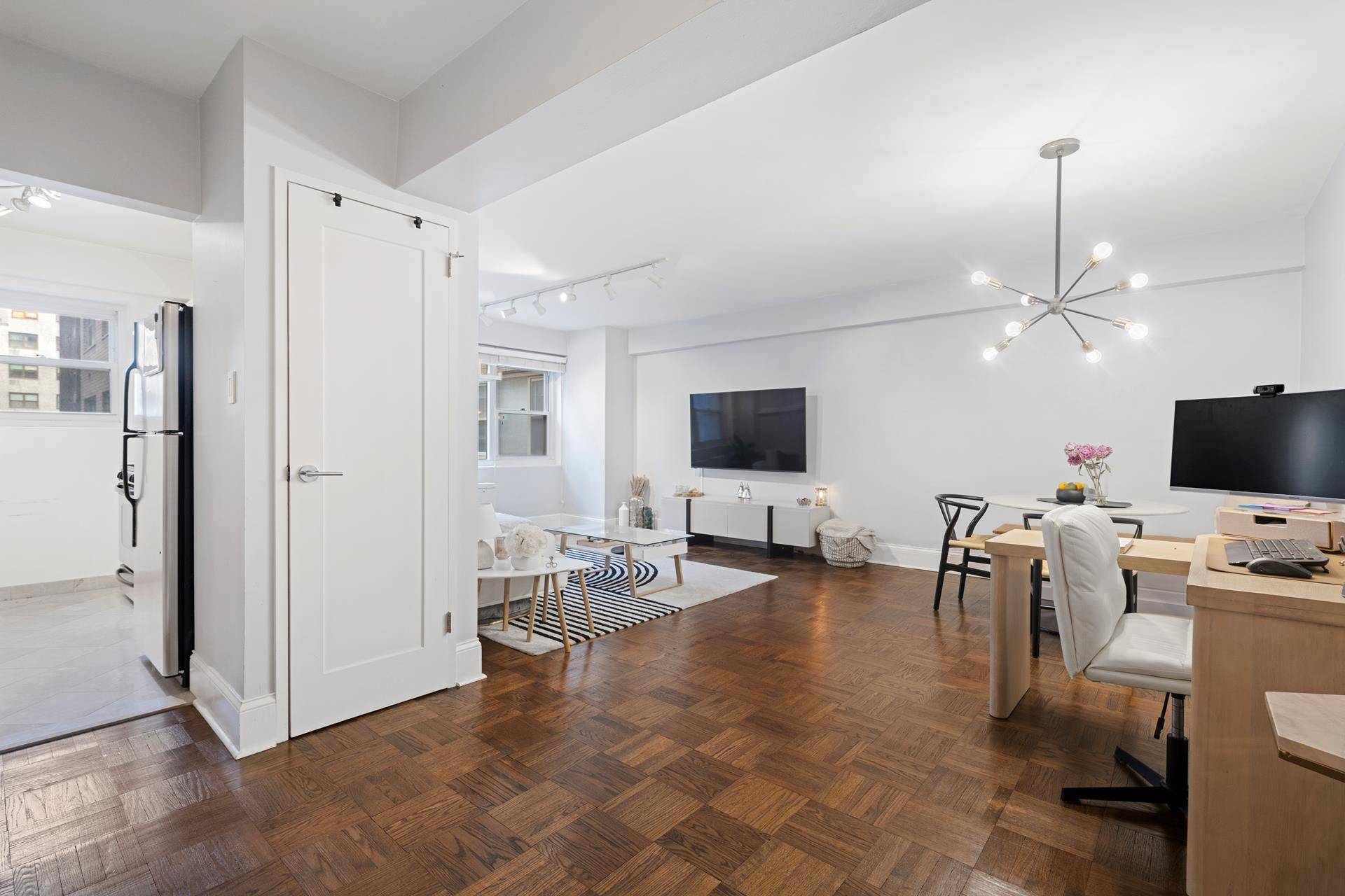 An incredibly large one bedroom apartment in a luxury post war building on East 56th Street.