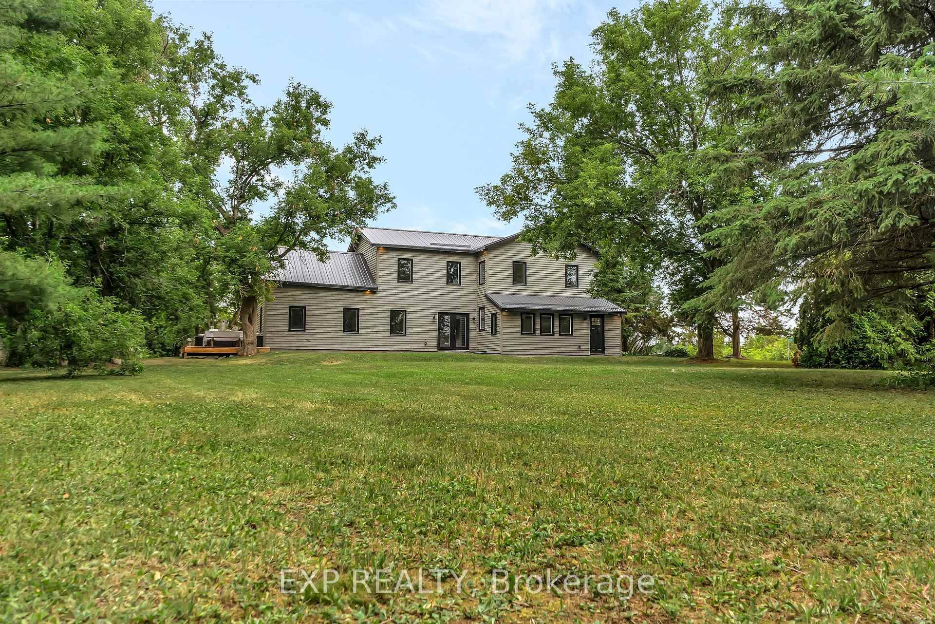 Welcome to 2452 County Road 4, beautifully renovated modern farmhouse nestled on just under 4 acres of scenic countryside in the heart of Stone Mills.