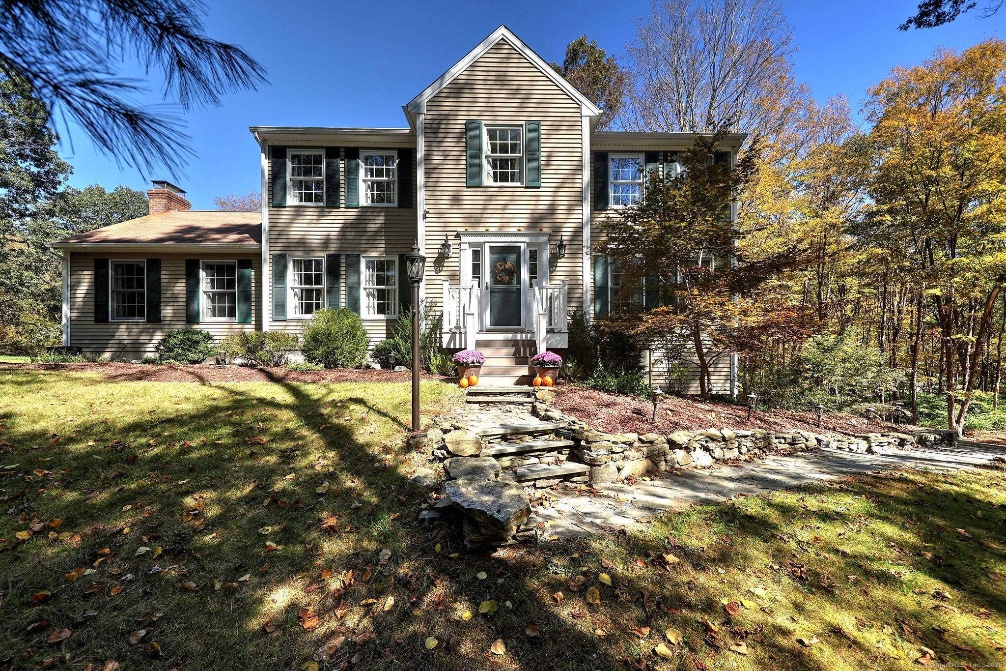 Fall in love with this colonial in a tranquil private setting on over 5 acres, yet close to everything.