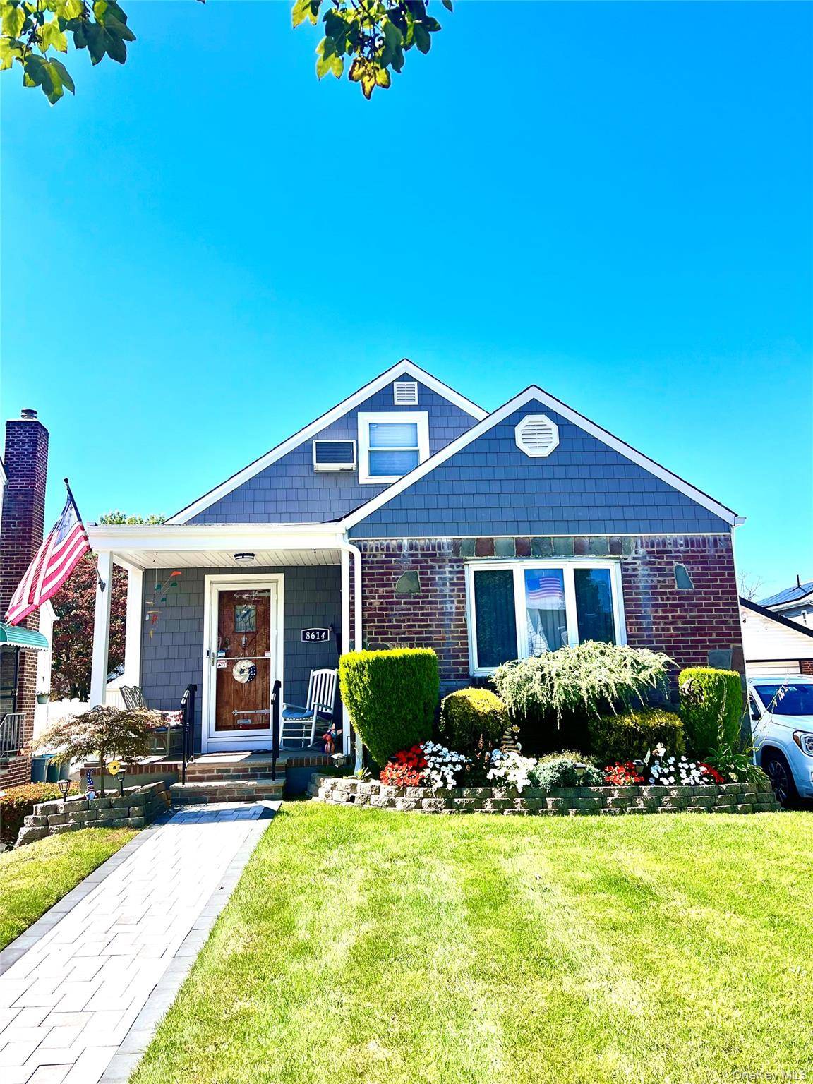 Charming and well kept Cape Cod nestled on a quiet, tree lined street.