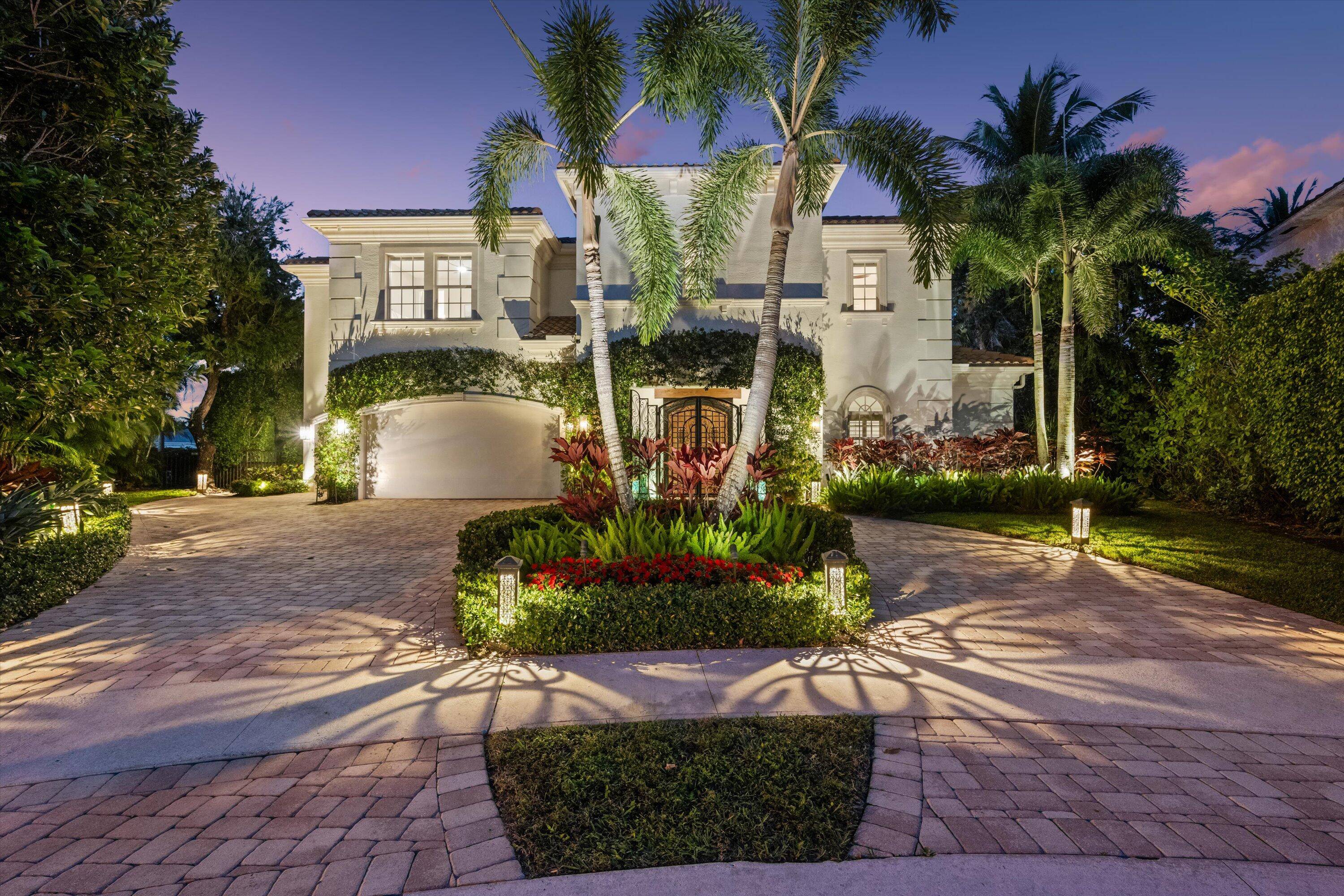Perfectly placed on a private cul de sac in the highly sought after Mizner Estates in Palm Beach Polo, this elegant 6 bedroom 5.