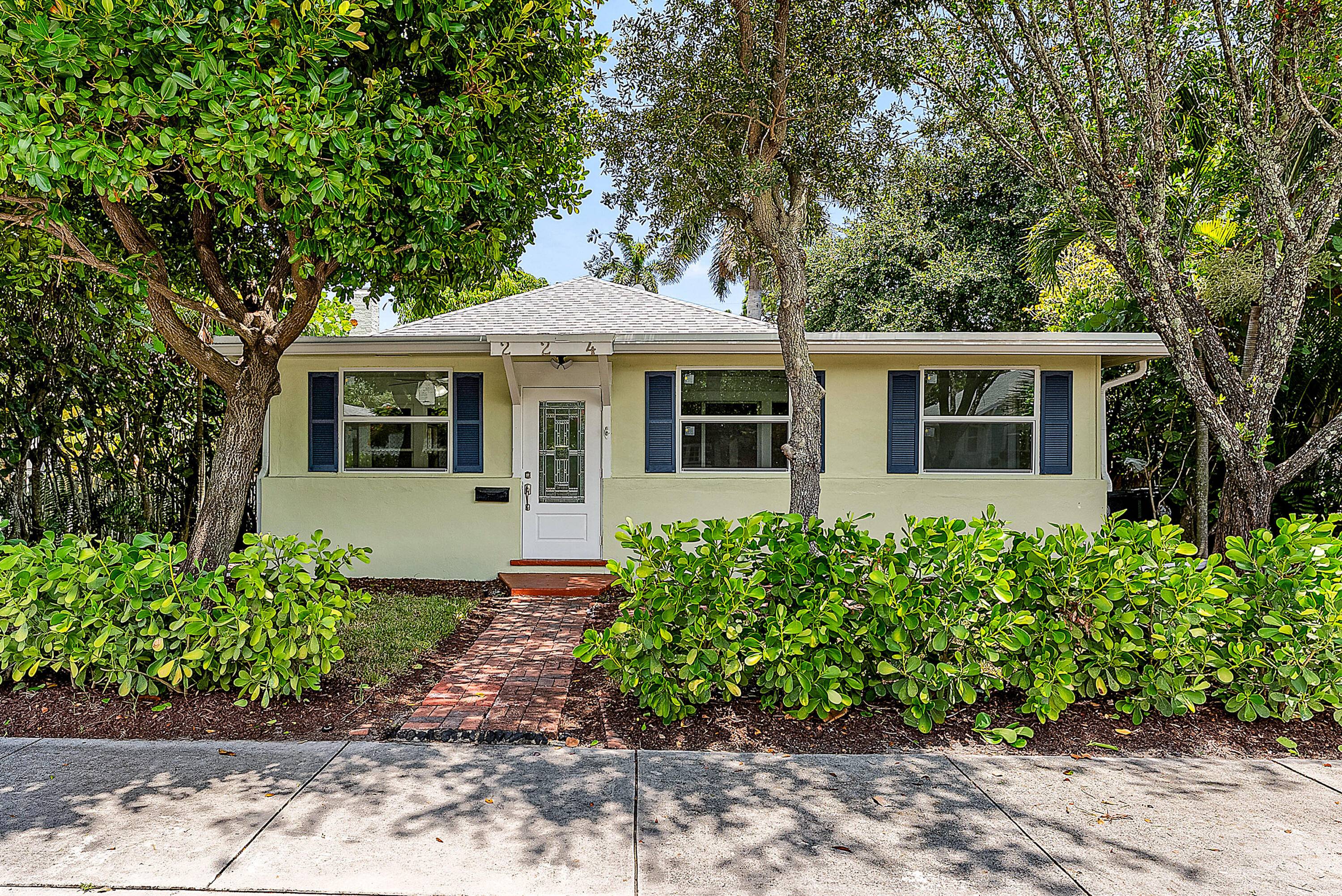 In the heart of downtown Lake Worth's historic district, this restored 1920s home blends timeless character with modern sophistication.