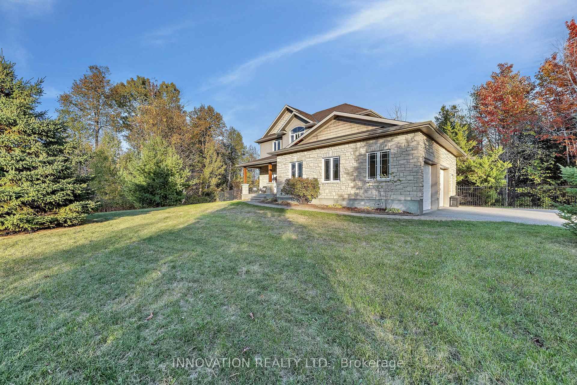 Welcome to 122 Country Meadow Drive an exceptional 4 Bedroom, 4 Bath residence nestled in one of Carp's most sought after estate communities on 2 acres.