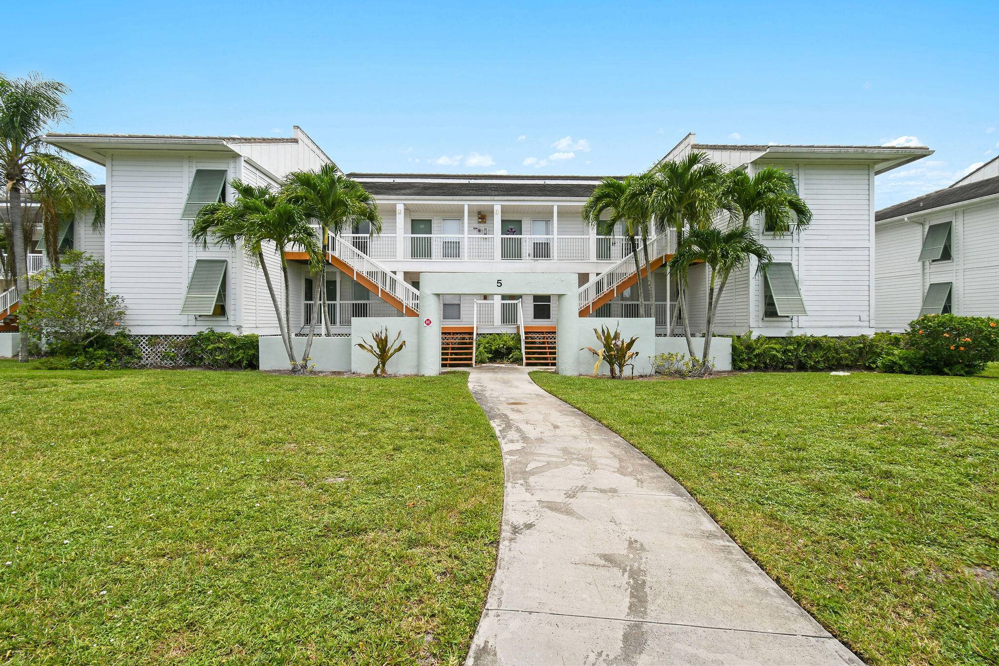 Completely renovated top floor condo with gorgeous lake views in the highly sought after Cypress Point PGA National.