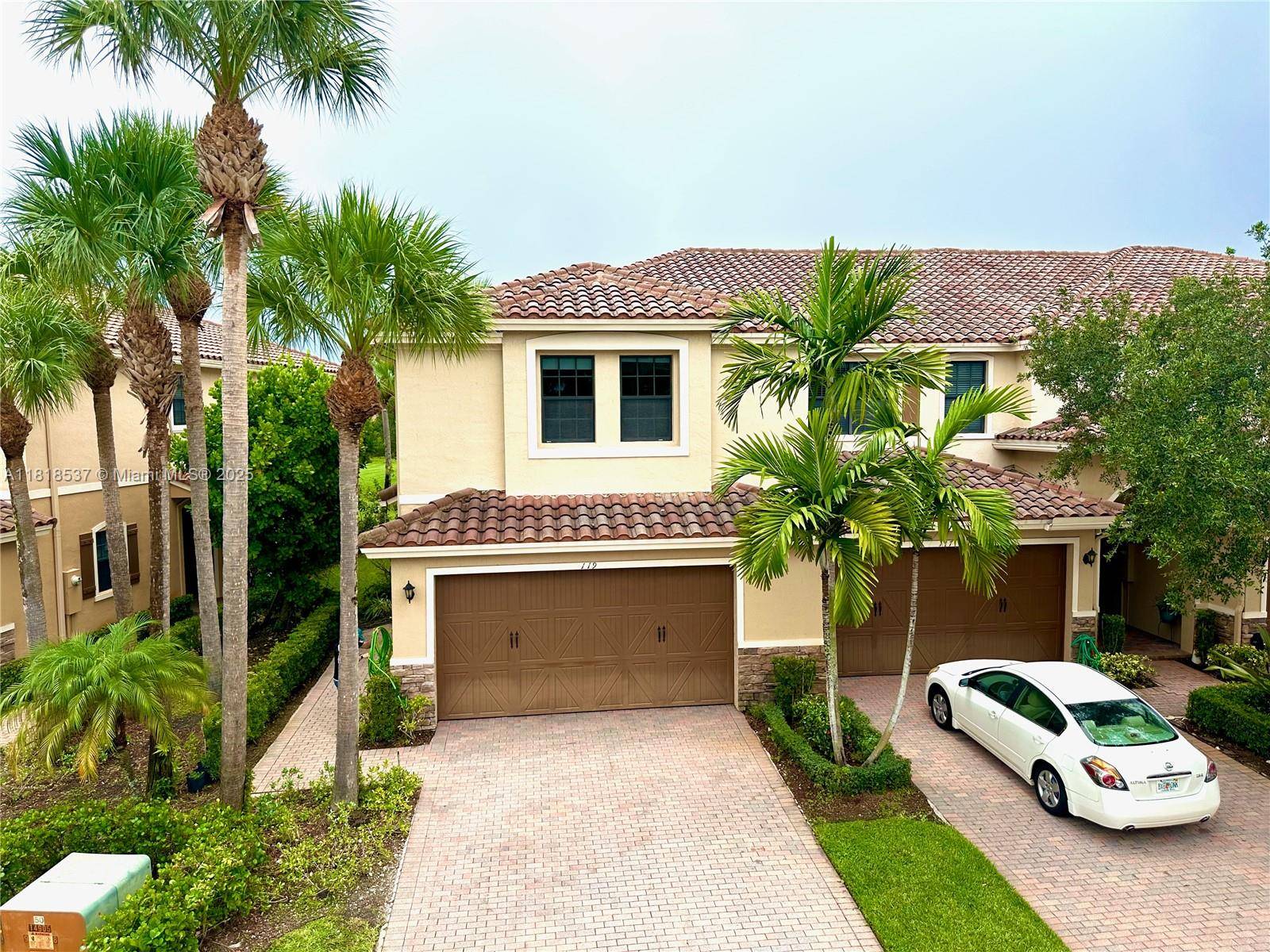 Beautiful corner townhome in the gated, private, family oriented Riverwalk Lago Mar.