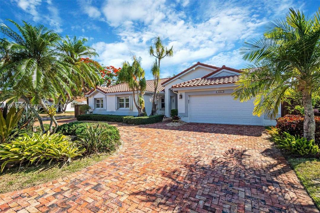 Gorgeous single family corner home in the highly desirable community of Lakes of the Meadow.