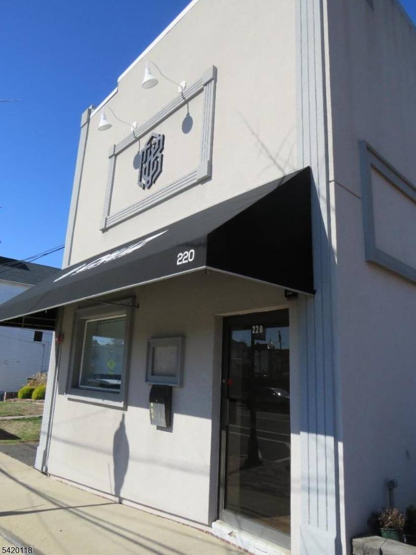 Calling all investors a commercial building located in a busy district area of Manville.