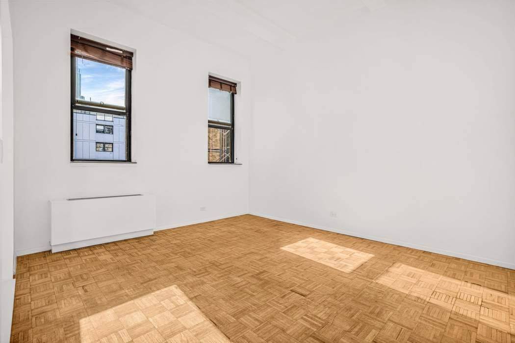 Loft Style Pre War Condo Across from Central Park Apartment 5L at 1255 Fifth Avenue is a rare pre war condominium offering dramatic 12 foot beam ceilings that create a ...