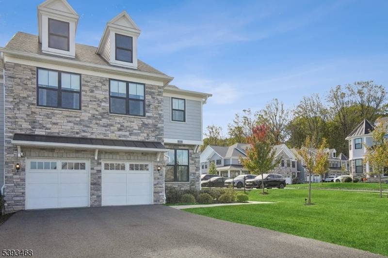 Experience refined living in this designer crafted end unit residence nestled within The Villas at Warren, one of the area's most desirable luxury communities.