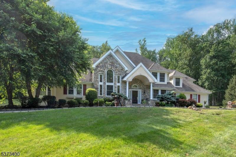 This stately Colonial sits atop a gentle rise in sought after Harding Township, known for its top rated schools and easy access to commuting routes.