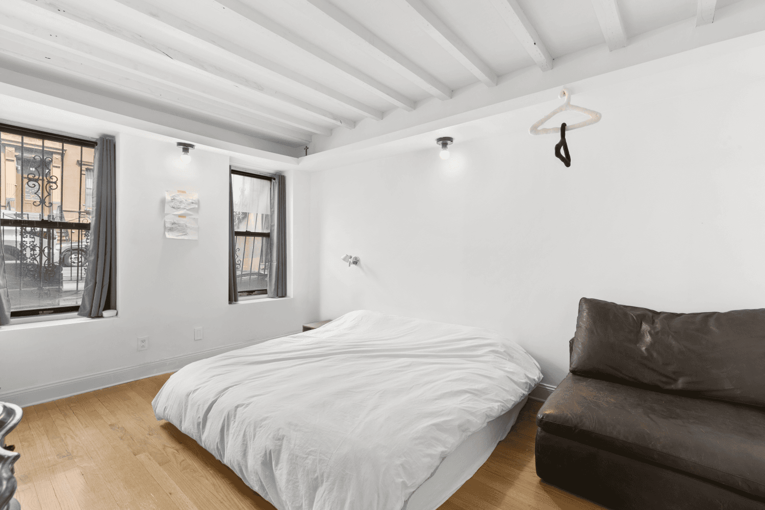 A 3 family brownstone with warmth, character, and smart design choices throughout !