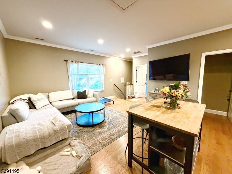 Experience luxury living in the heart of Morristown with this newly constructed, oversized three bedroom, three and a half bath duplex just two blocks from the Green.
