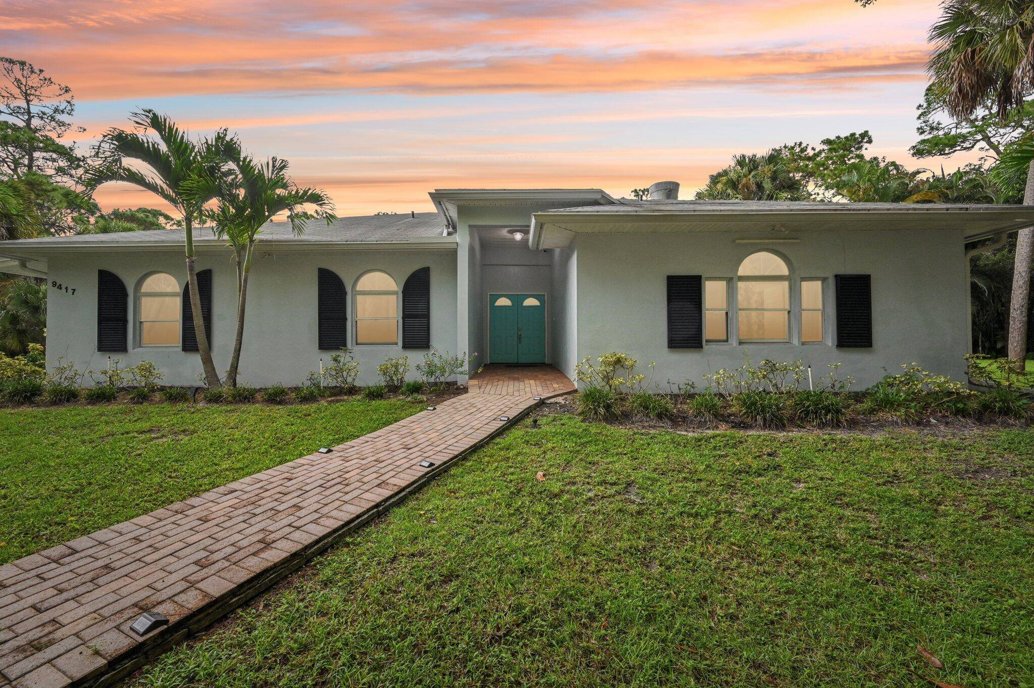 Experience the best of Jupiter Farms living on this private 2.