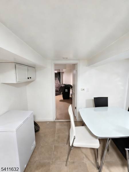 Income producing two family home offering strong upside potential in Newark.