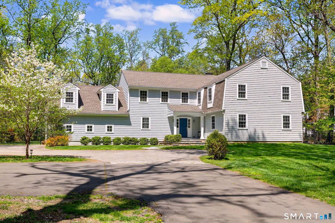 Welcome to 4 Cardinal Lane a beautifully expanded and thoughtfully updated home set on two private, level acres in one of Westport's most desirable cul de sac neighborhoods.