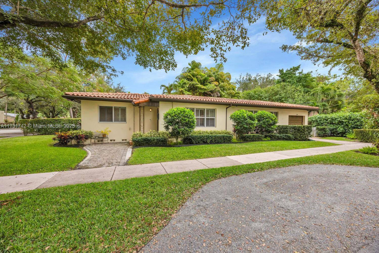 Enchanting North Coral Gables home packed with charm and modern upgrades !