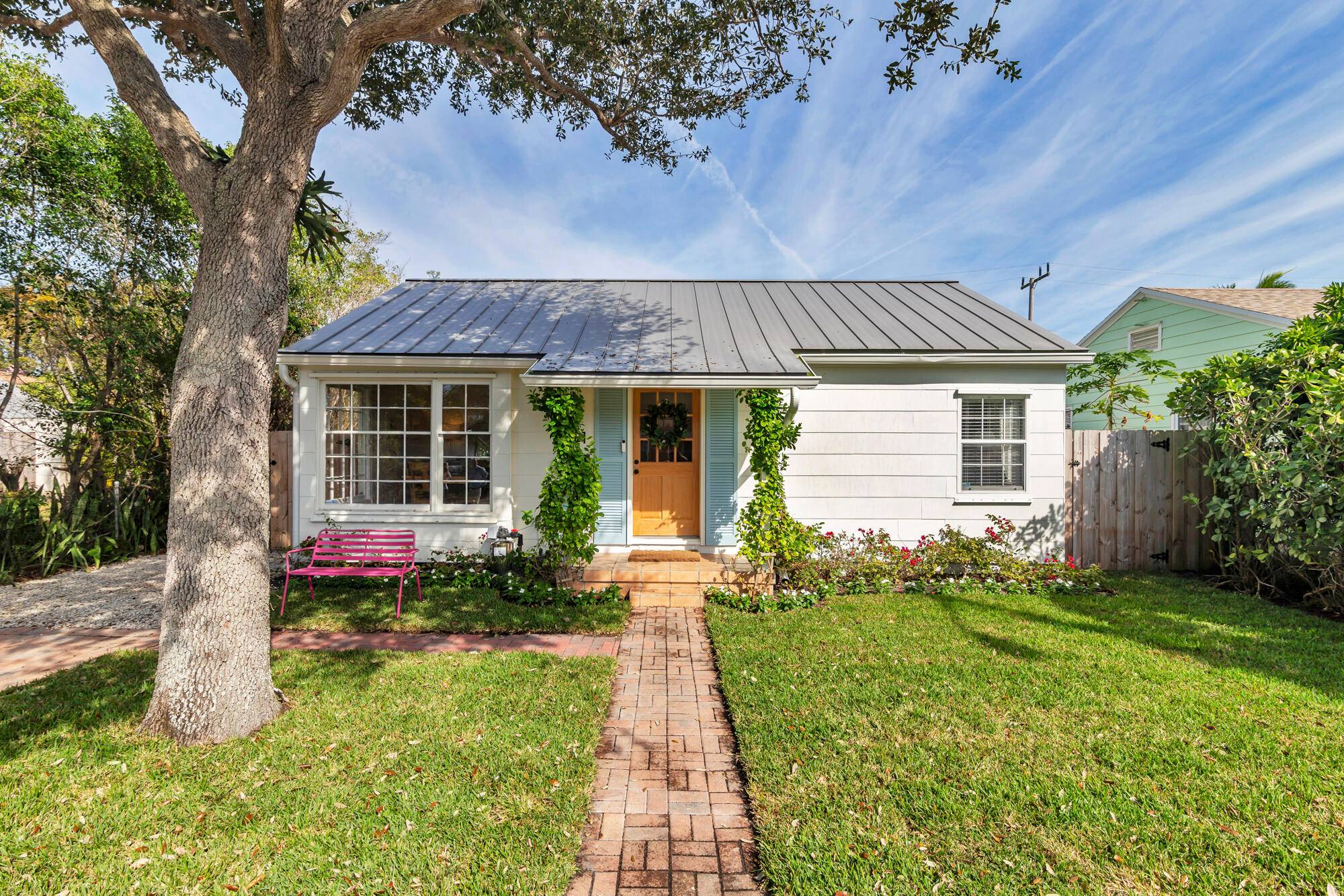 Old Florida charm abounds at this 1940s Key West cottage with the storybook style of a bygone era but all the updates for modern living.