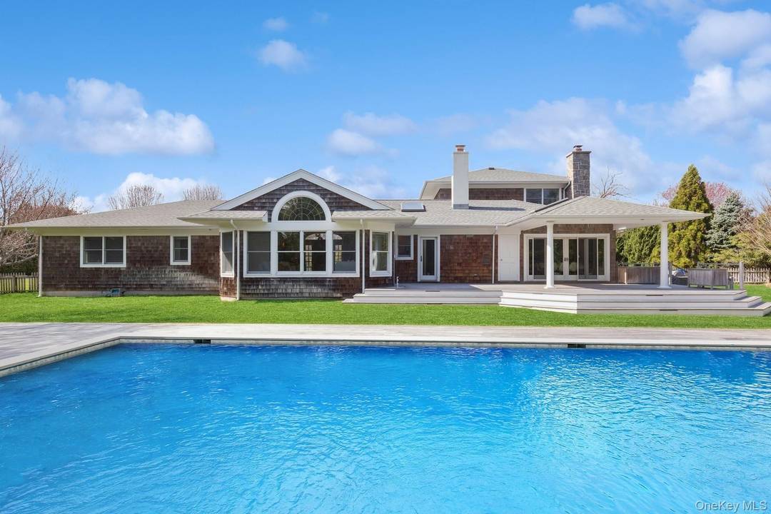 Welcome to 8 Niamogue, located in the heart of the coveted Quogue Estate Section, set on over an acre, merely a block away from Dune Rd.