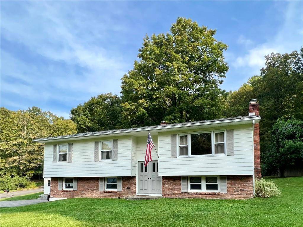 Welcome to this stunning raised ranch nestled on two combined parcels totaling just under half an acre.