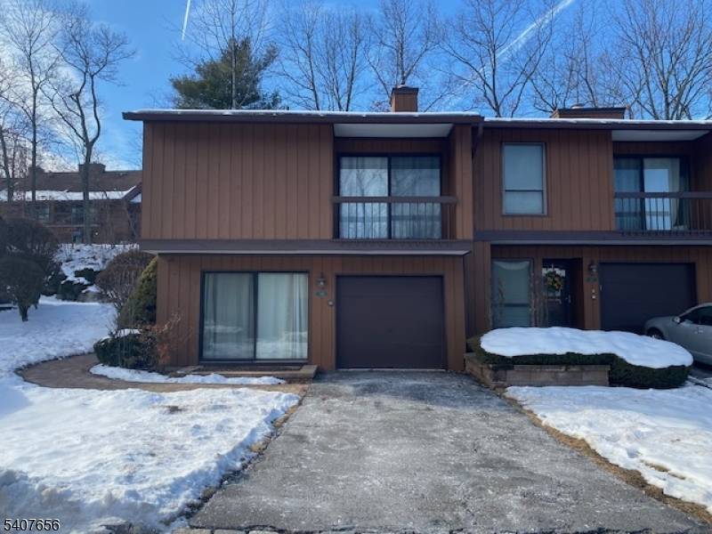 This desirable end unit townhome offers exceptional privacy and abundant natural light in the highly sought after Overlook Village of Wharton, New Jersey.