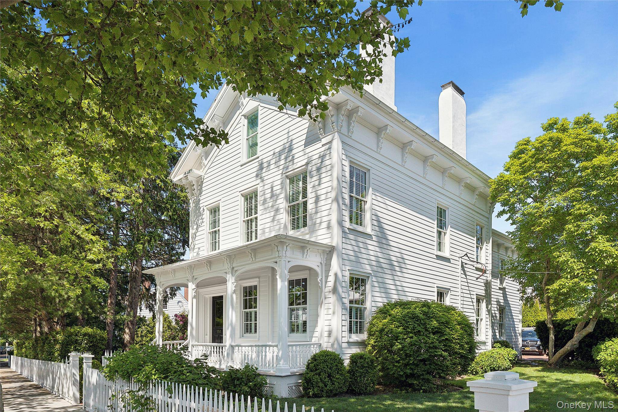 Nestled on Captains Row in Sag Harbor Village, this elegant historic residence has been meticulously restored.