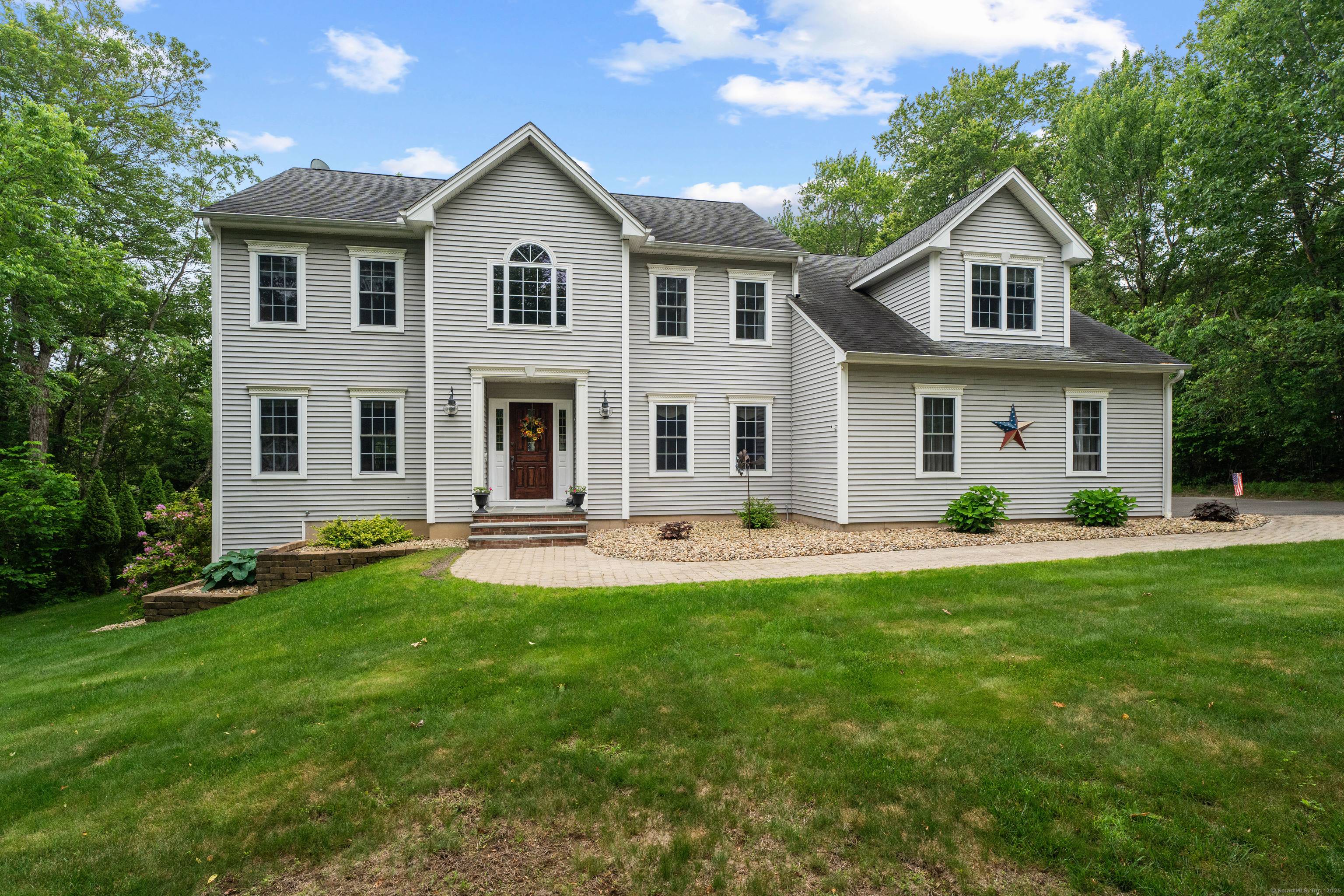 Custom built estate nestled in the scenic hills of the highly sought after Johnnycake area !