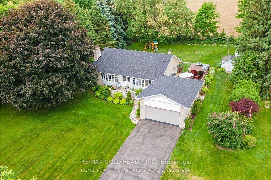 Beautiful 3 Bedroom All Brick very well kept Bungalow with Double car Garage situated on almost an Acre Lot.