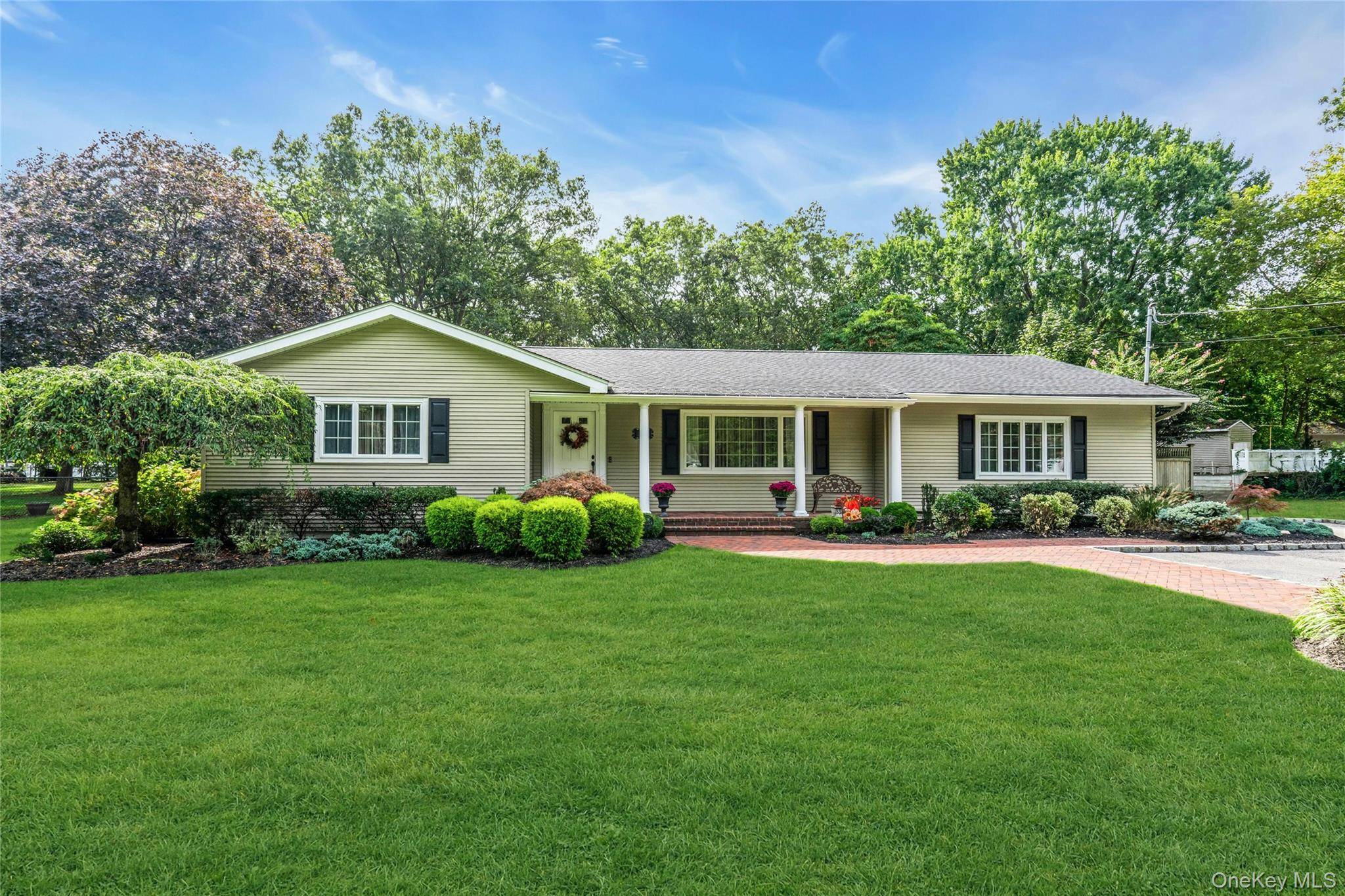 Welcome to 68 Churchill Lane, a beautiful home nestled in the heart of Smithtown Pines.