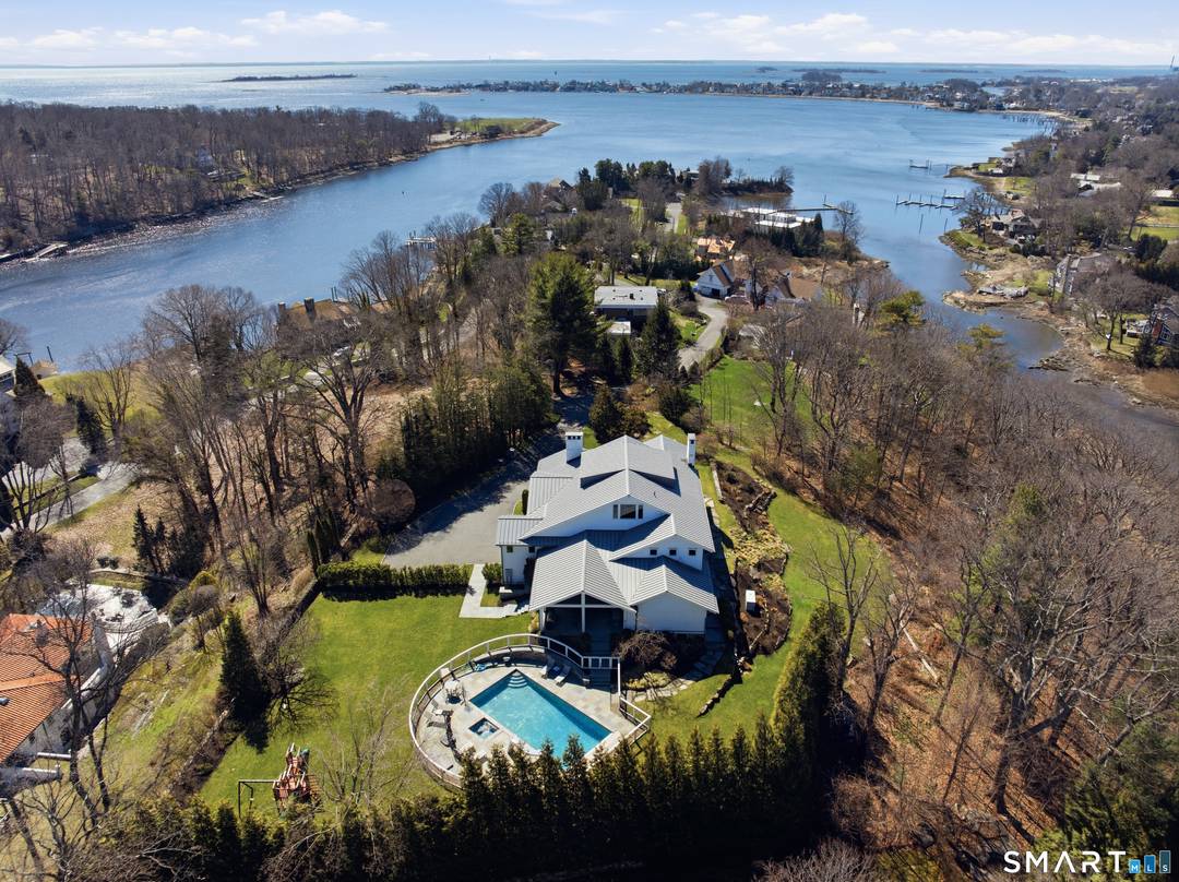 Located within the highly desirable Stony Point association, this exceptional home offers a rare combination of privacy, water views, and convenience just moments from the train, local restaurants, and everyday ...