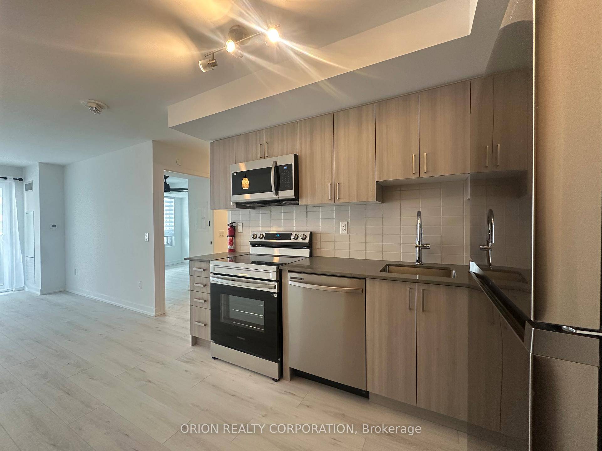 Modern 1 bedroom den condo with east facing exposure and a private balcony, perfect for soaking in morning sun.