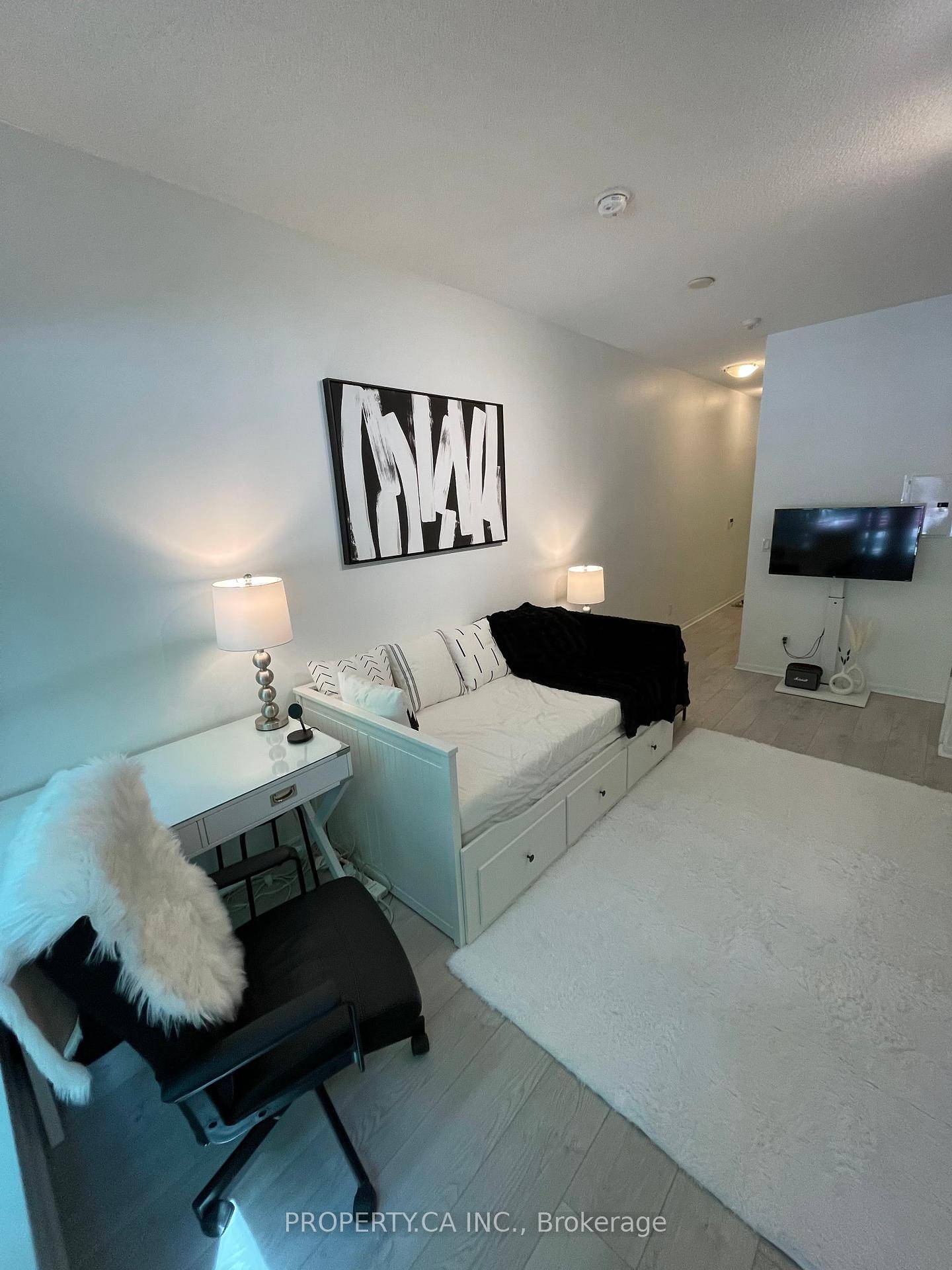 Rare ground floor studio bachelor apartment with a private gated patio and dual access direct entry from outside and interior hall entry from the building.