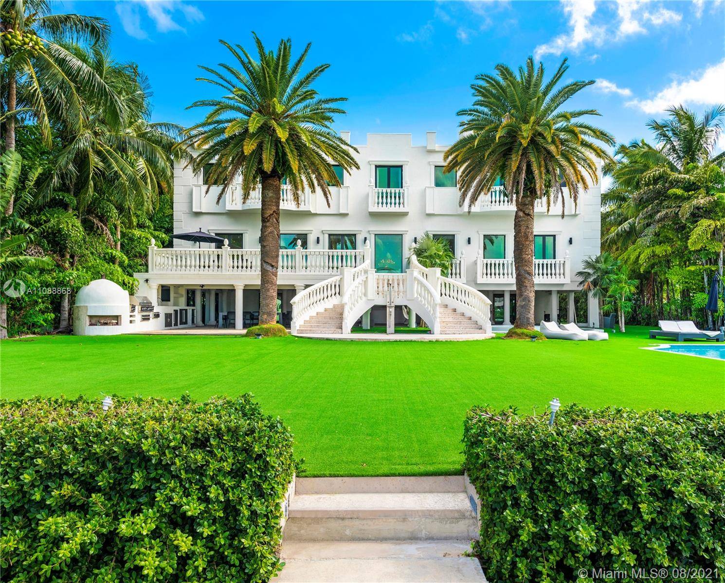 Located in the prestigious gated Palm Island, this grand residence is a rare opportunity.